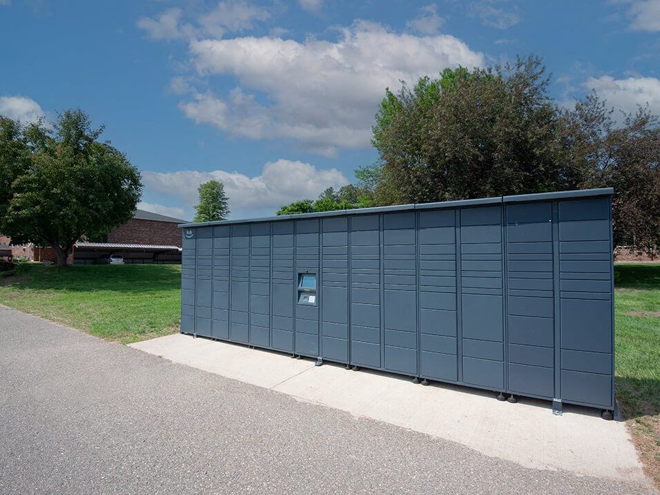 a large blue metal building with a sign on the side of it