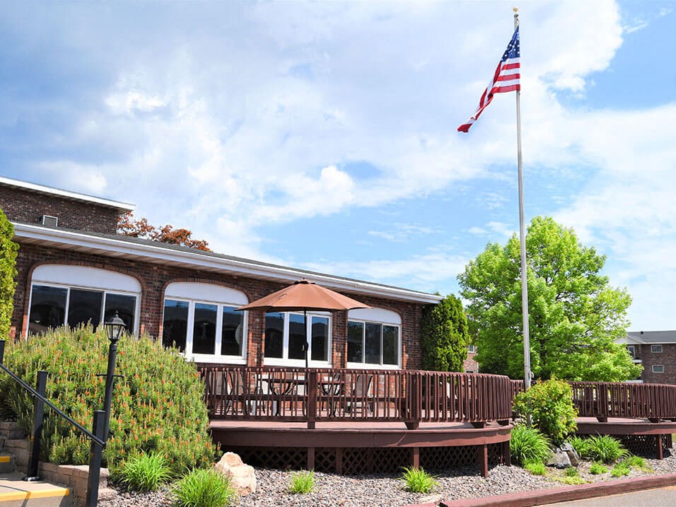 a building with an american flag in front of it
