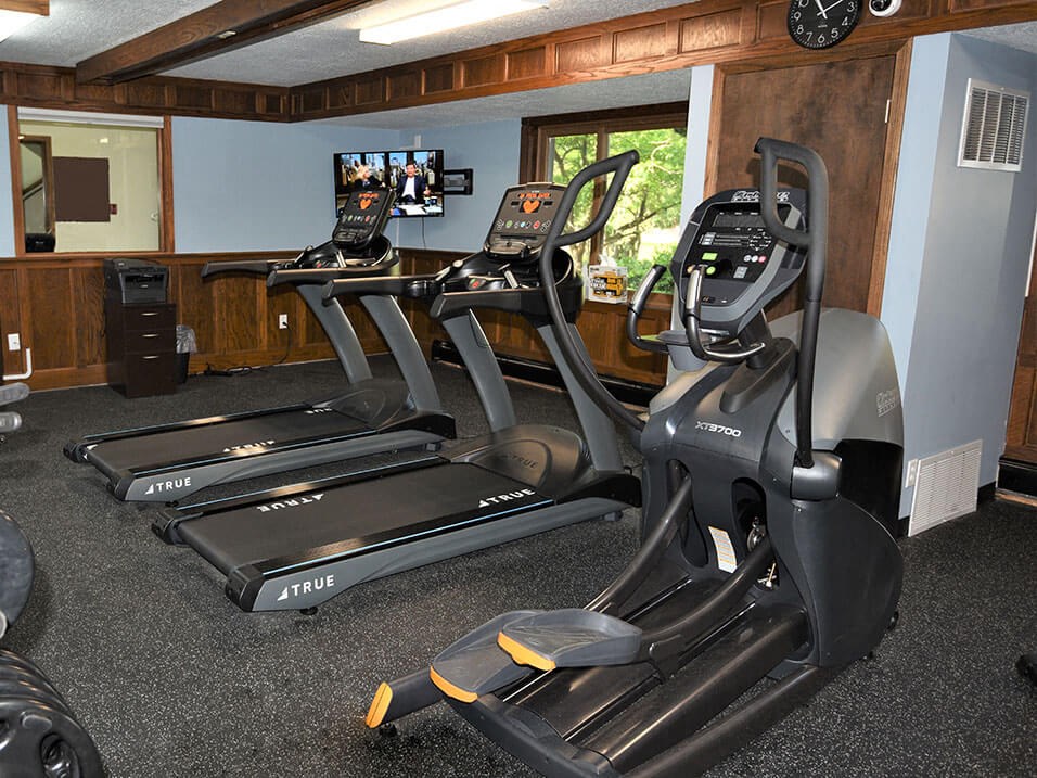a room filled with furniture and a flat screen tv