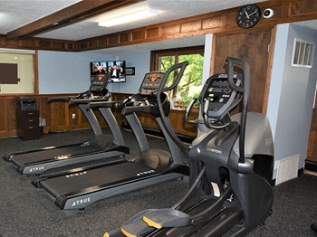treadmill and elliptical at apartment gym - Photo Gallery 10