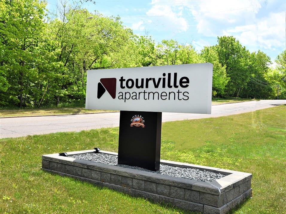 sign located outside tourville apartments