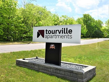 sign located outside tourville apartments - Photo Gallery 22