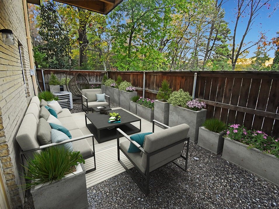 a patio with couches and chairs and a table