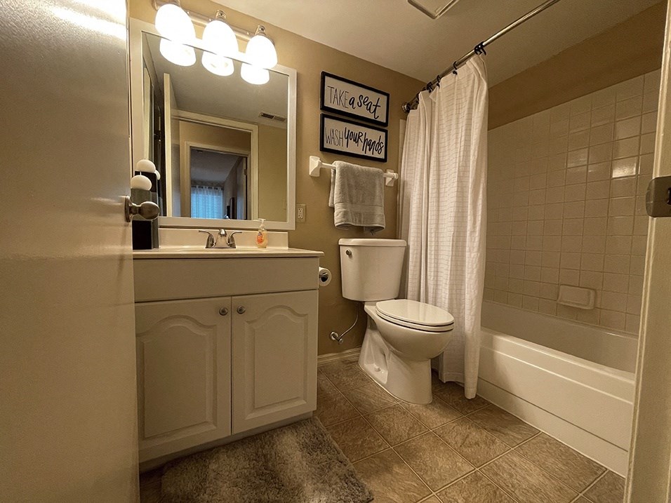 a bathroom with a toilet sink and bathtub