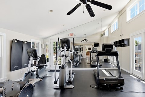 A spacious gym with a variety of exercise equipment.
