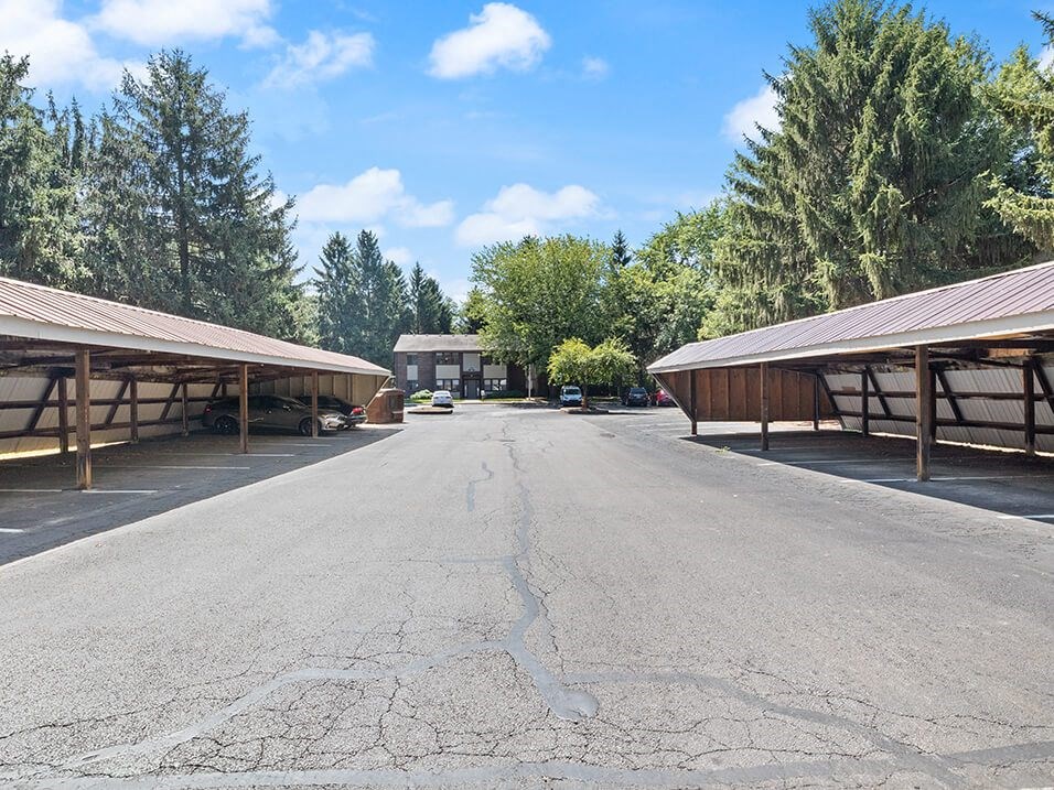 apartment community with parking lot carports