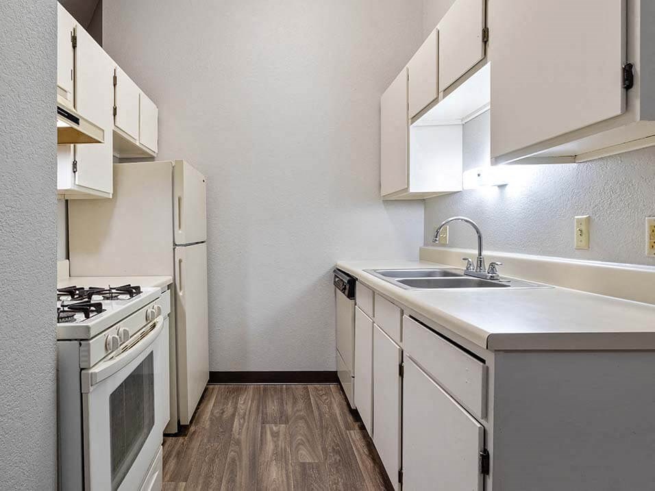 apartment kitchen with a stove and refrigerator