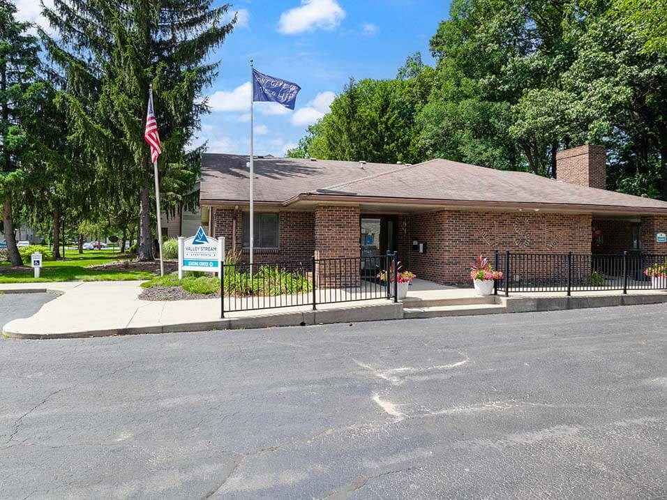 a brick leasing office at Valley Stream Apartments