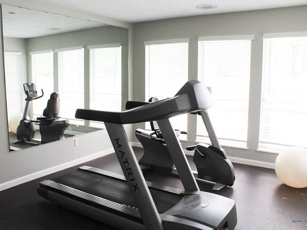 gym with a treadmill at apartment complex