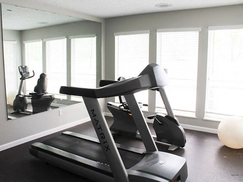 gym with a treadmill at apartment complex