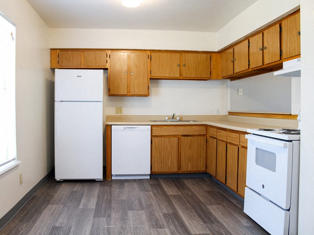 apartment kitchen with white appliances
