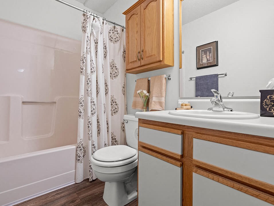 a bathroom with a sink toilet and a shower