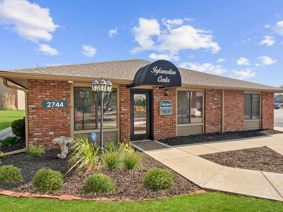 the front of a building with a sign on it