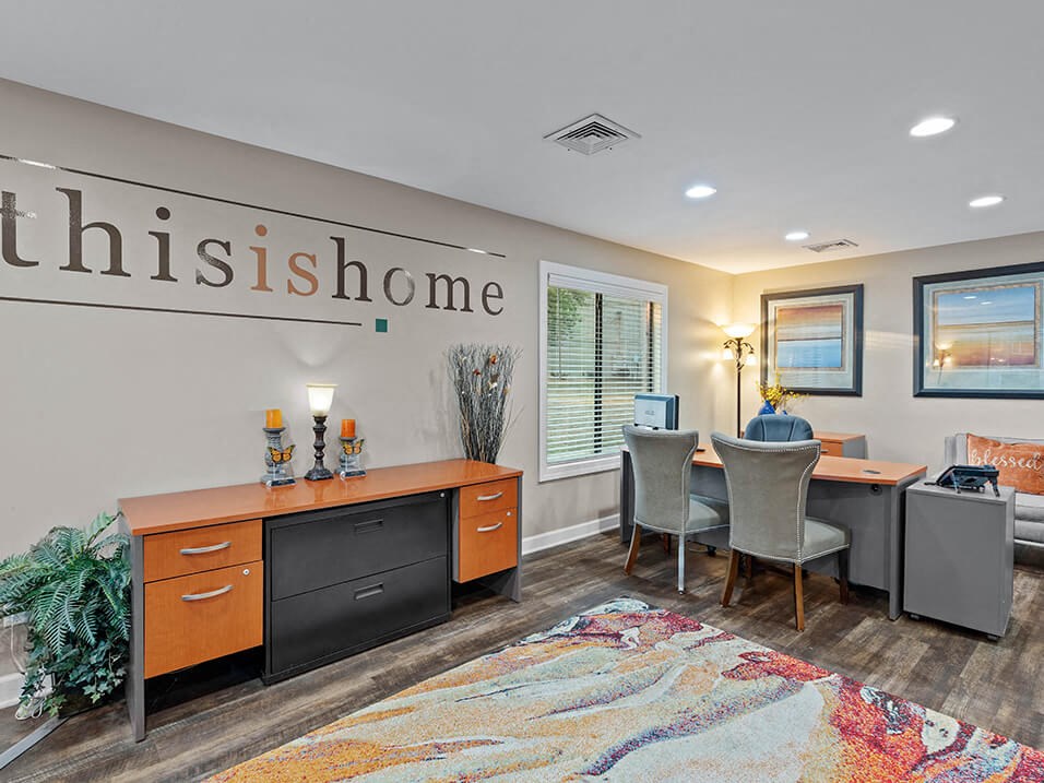 a conference room with a desk and a chair