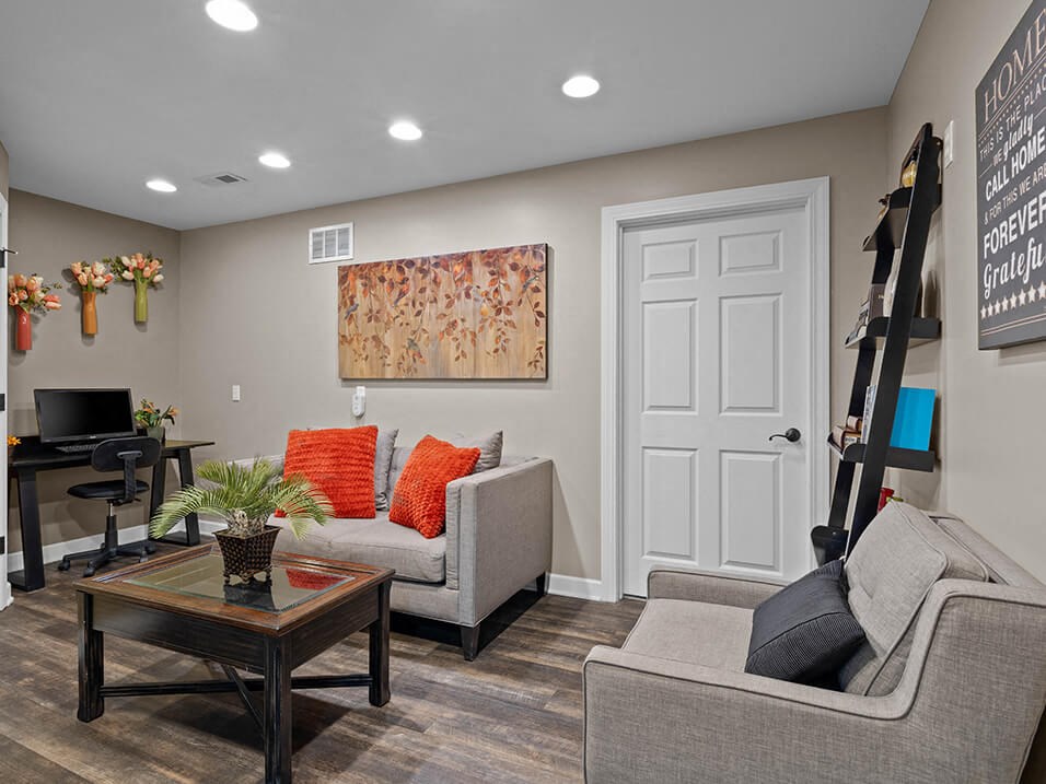 a living room with couches and a coffee table