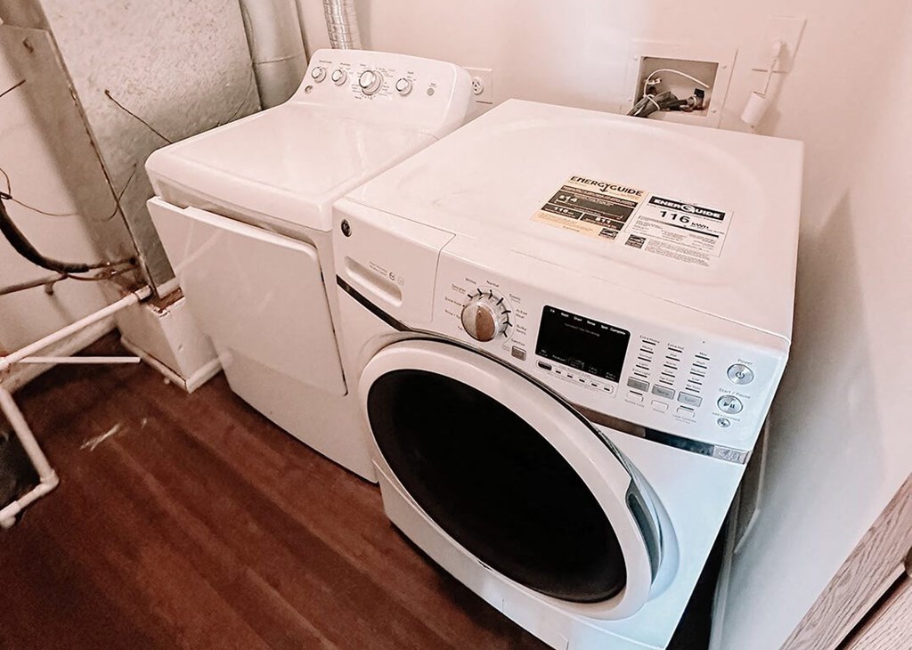 a washing machine and a dryer in a room