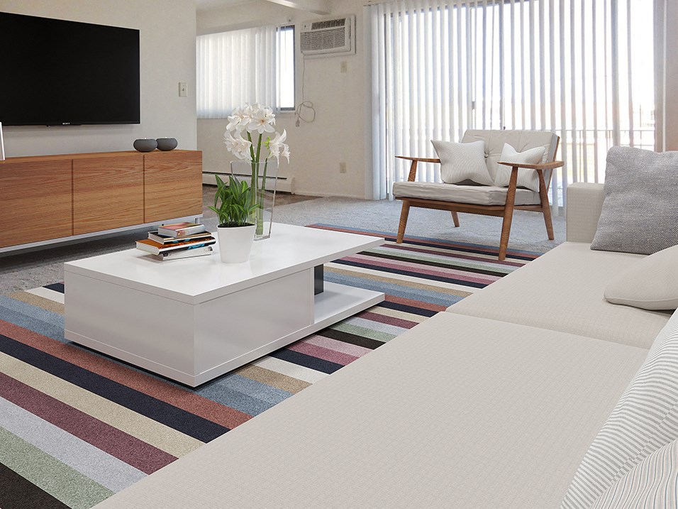 Living room with Large window and natural light at west broadway apartments