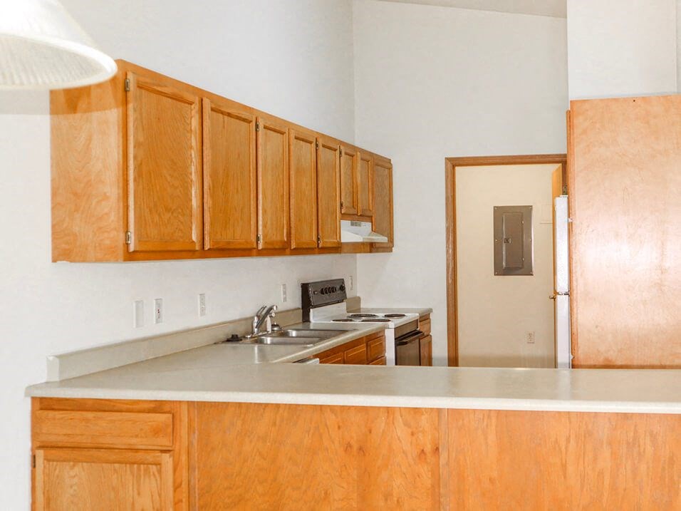 Kitchen area with lots of storage space at willow crossings apartments