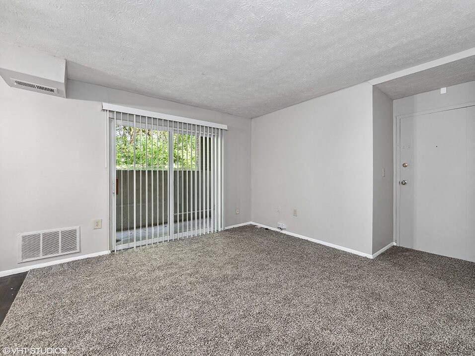 living room with a door to a balcony