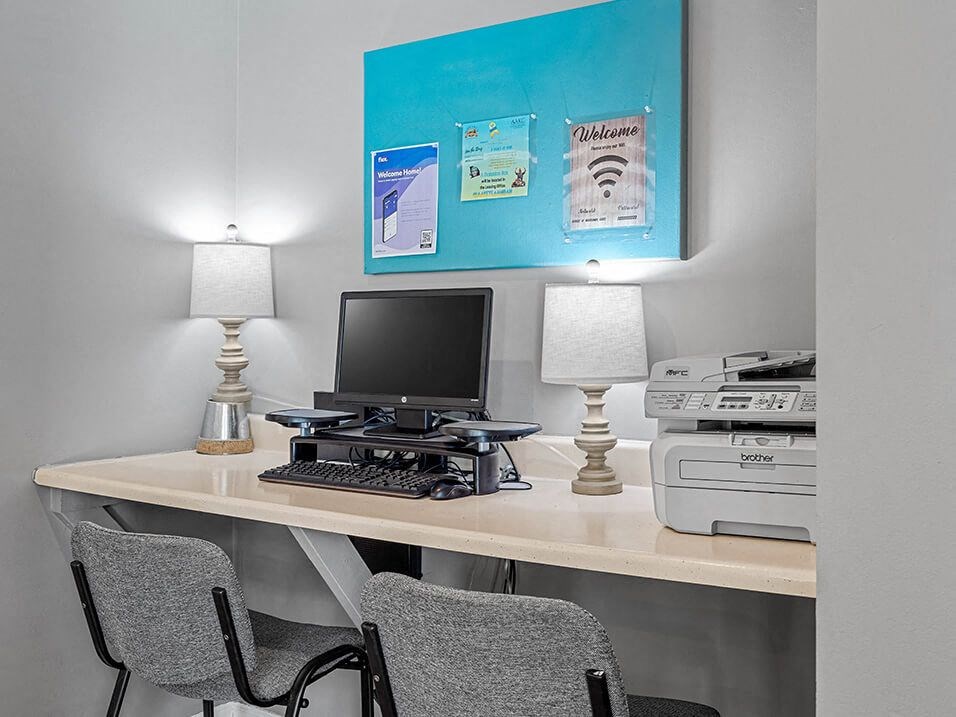 business center with a computer and printer