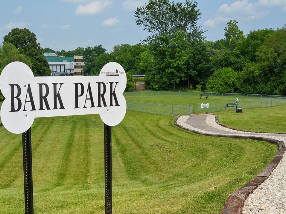 a park with a sign that reads bark park