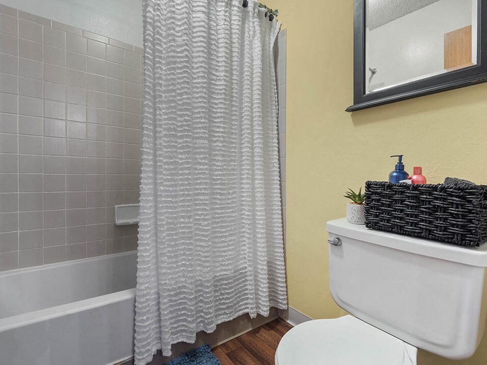 apartment bathroom with a shower tub