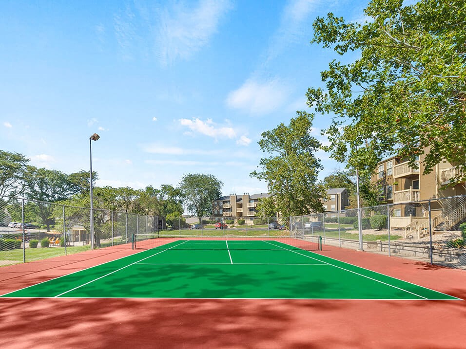 tennis court at the apartment community