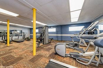 a gym with various exercise machines and weights