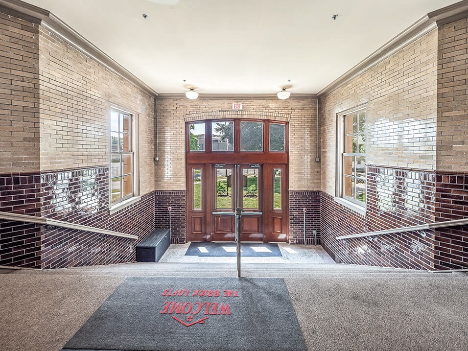 lobby at historic high school converted to lofts