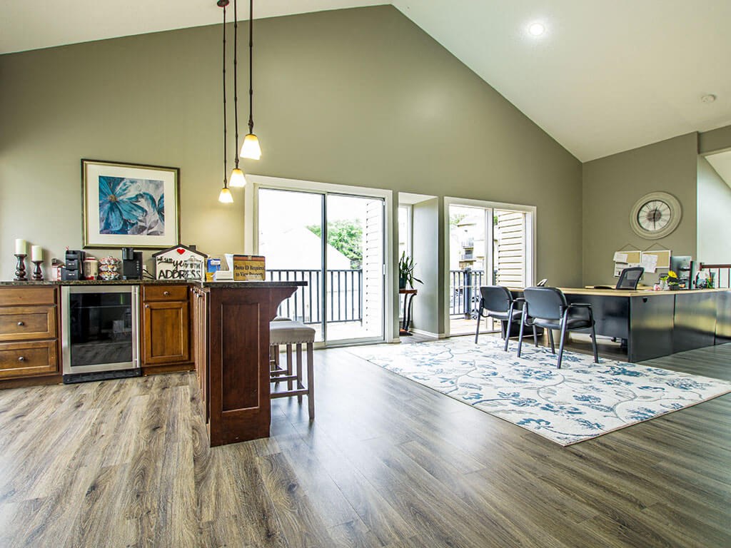 a living room with a kitchen and a dining room