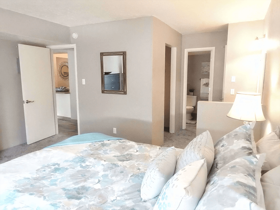spacious primary bedroom with connected bathroom