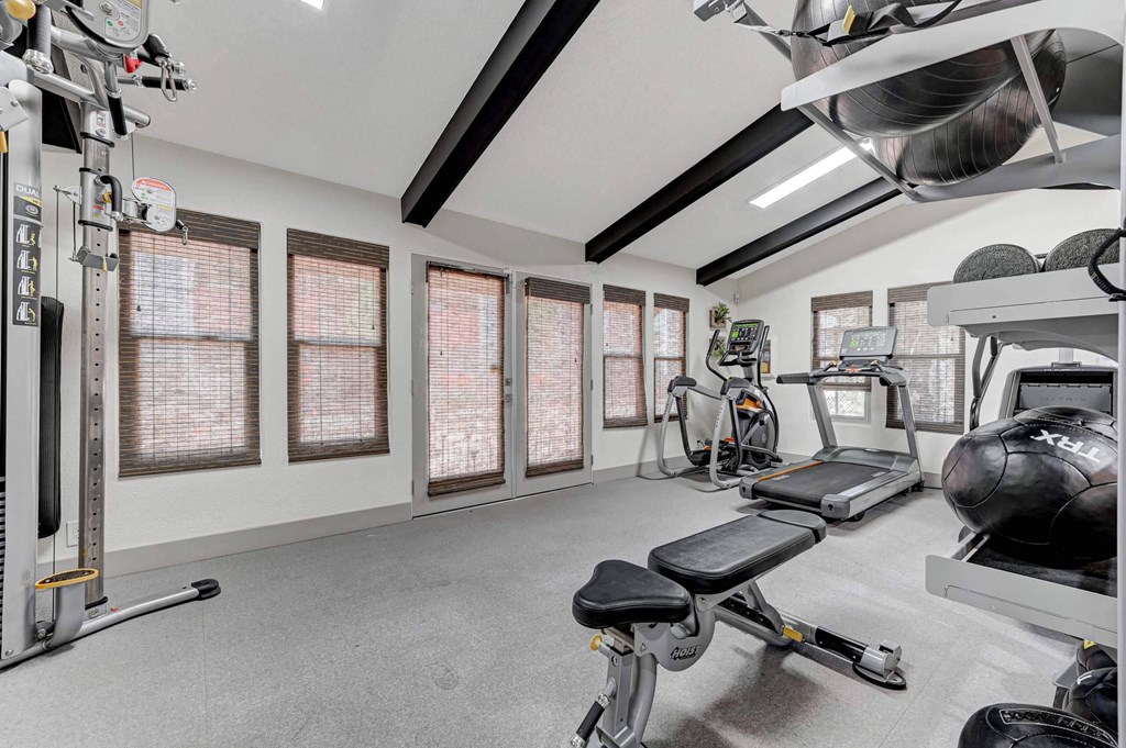 A well-equipped home gym with a variety of exercise machines. at Namaste Apartments, Las Vegas, NV