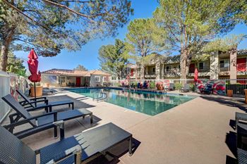 Pool With Relaxing Chairs at Solstice Apartment Homes, Las Vegas, NV