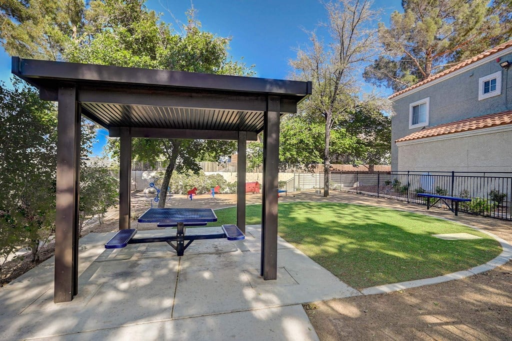 A park with a pavilion and a bench. at Solstice Apartment Homes, Las Vegas, 89108