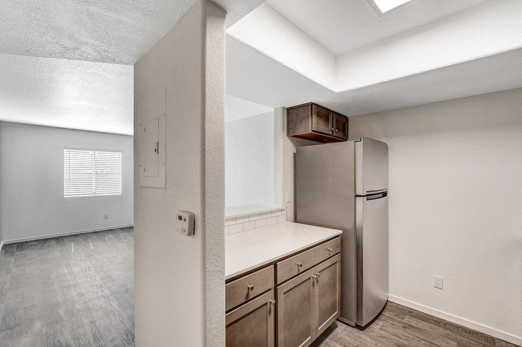 A kitchen with a refrigerator and a countertop. at The 95 Apartments, Nevada