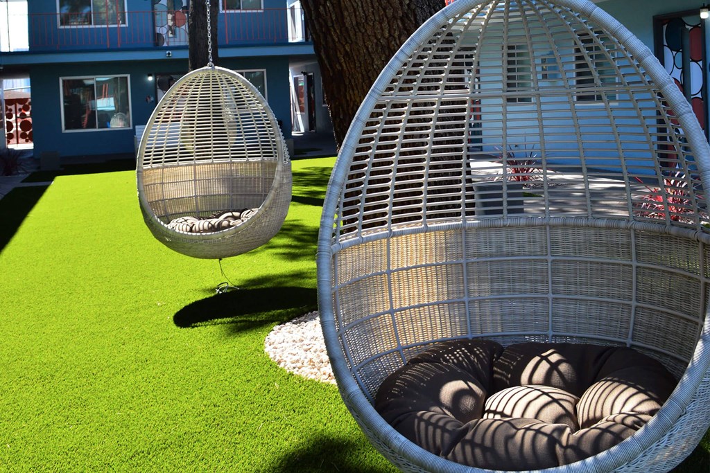 A large birdcage with a smaller one next to it. at The Neon Apartments, Las Vegas