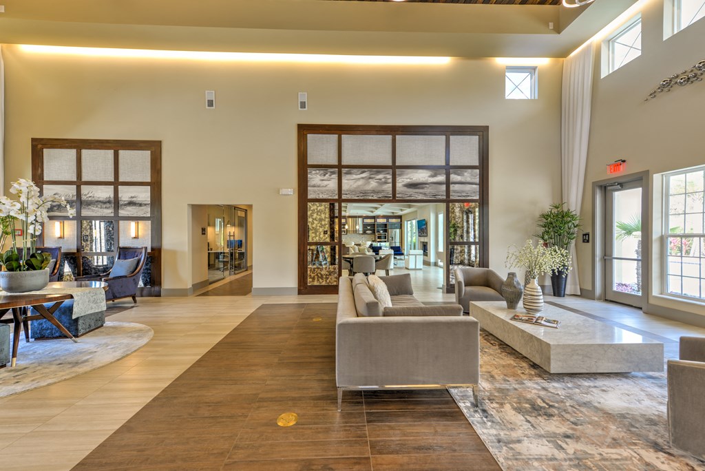 a large living room with couches and a table