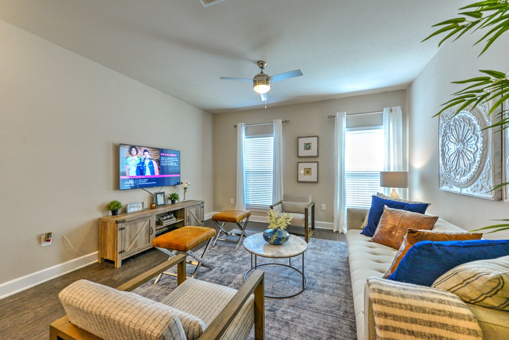a living room with a couch and a tv