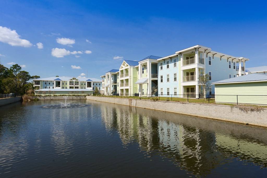 a large body of water with buildings on the side of it