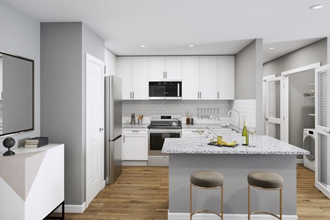 a kitchen with white cabinets and a marble counter top