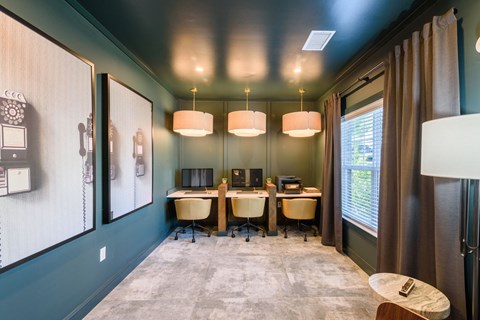 a conference room with a desk and chairs and a tv