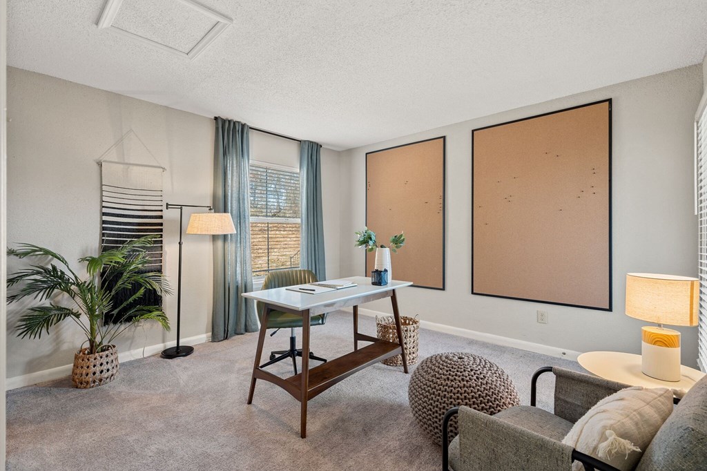 the preserve at ballantyne commons living room with windows and a desk