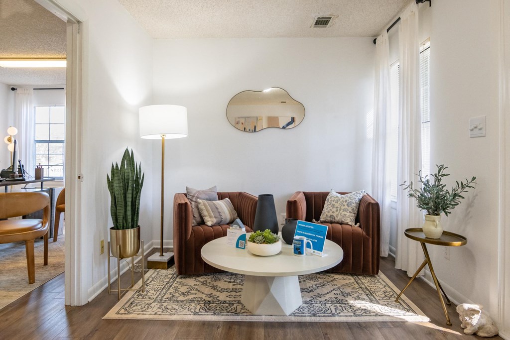 a living room with a couch and a round table