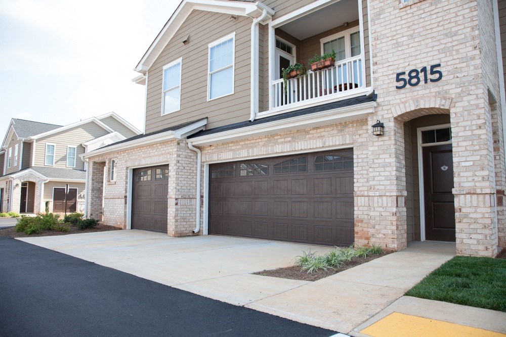 View of exterior unit and garage.
