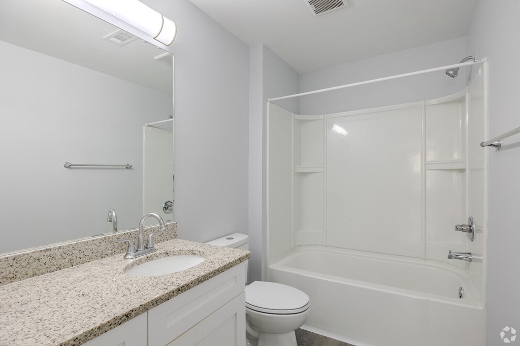 a bathroom with a sink toilet and a shower