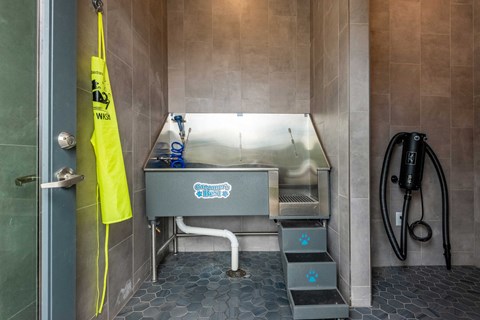 a small wet room with a sink and a shower