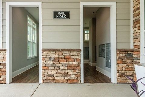 the view of the entrance to a building with a stone wall and a door with