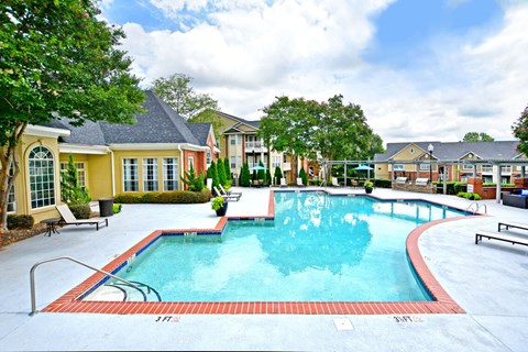 A large swimming pool surrounded by a red border.