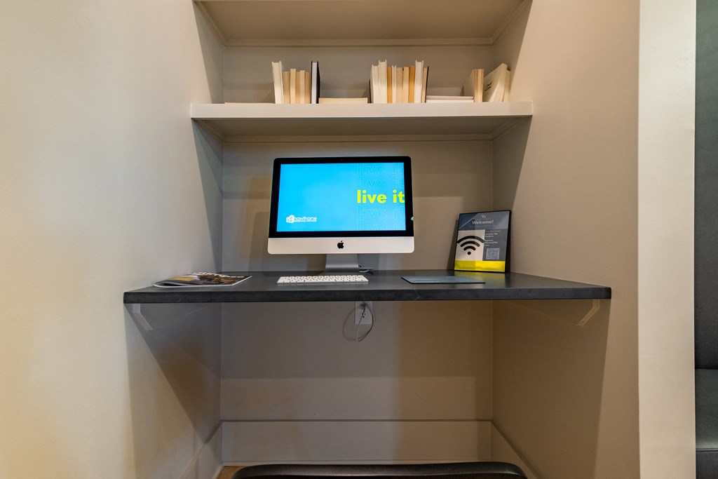 a computer on a desk in a room