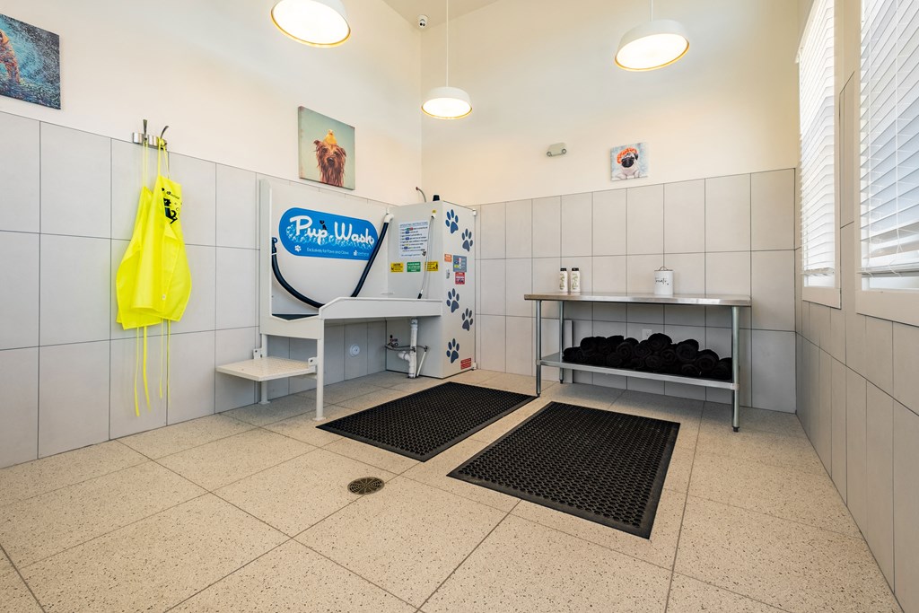 a washroom with a sink and a mirror in a public restroom